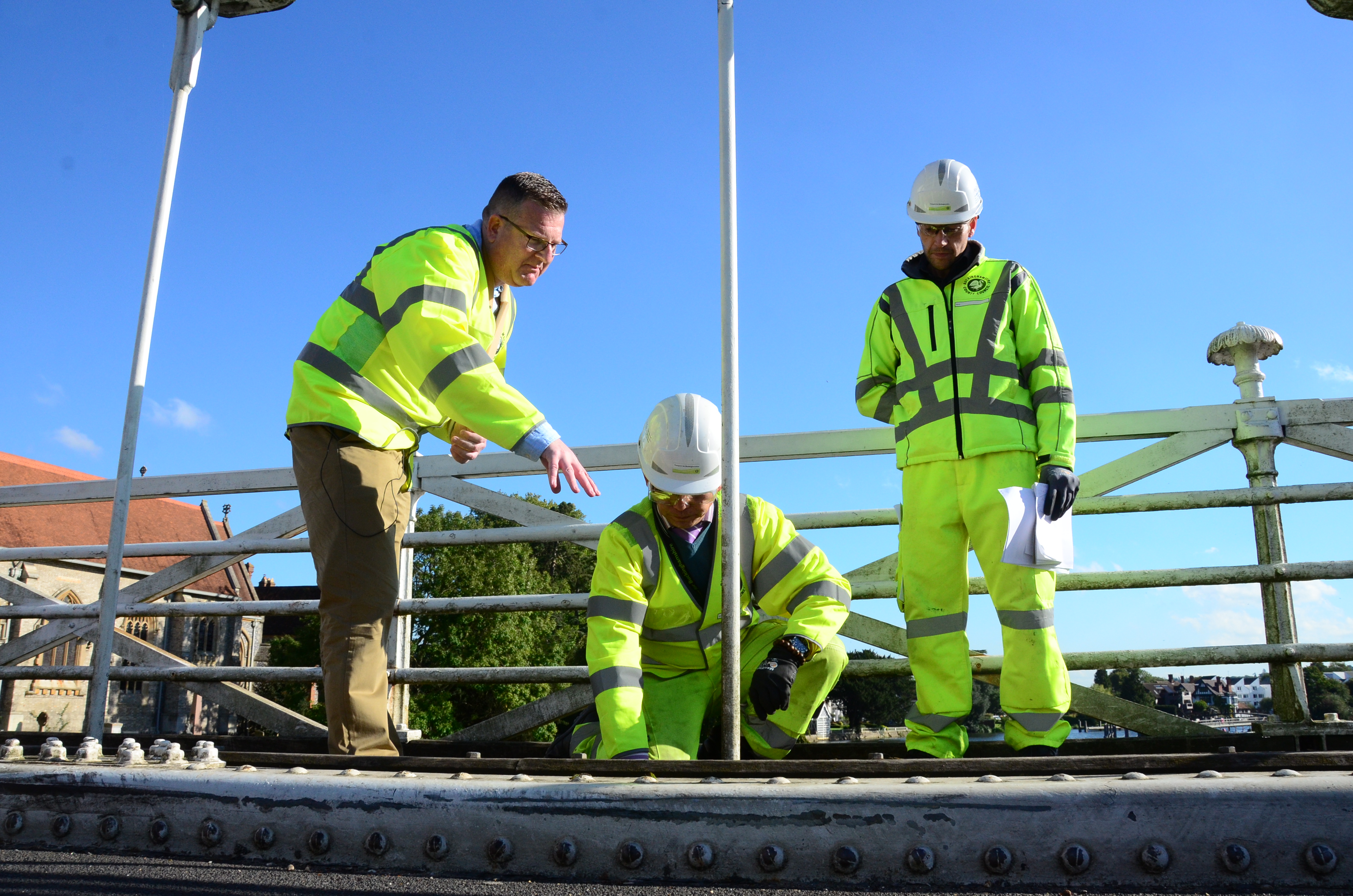 Mark Shaw with structural engineers examining hangers and pins on Marlow Bridge